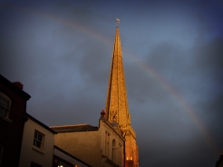 Photo of rainbow behind church
